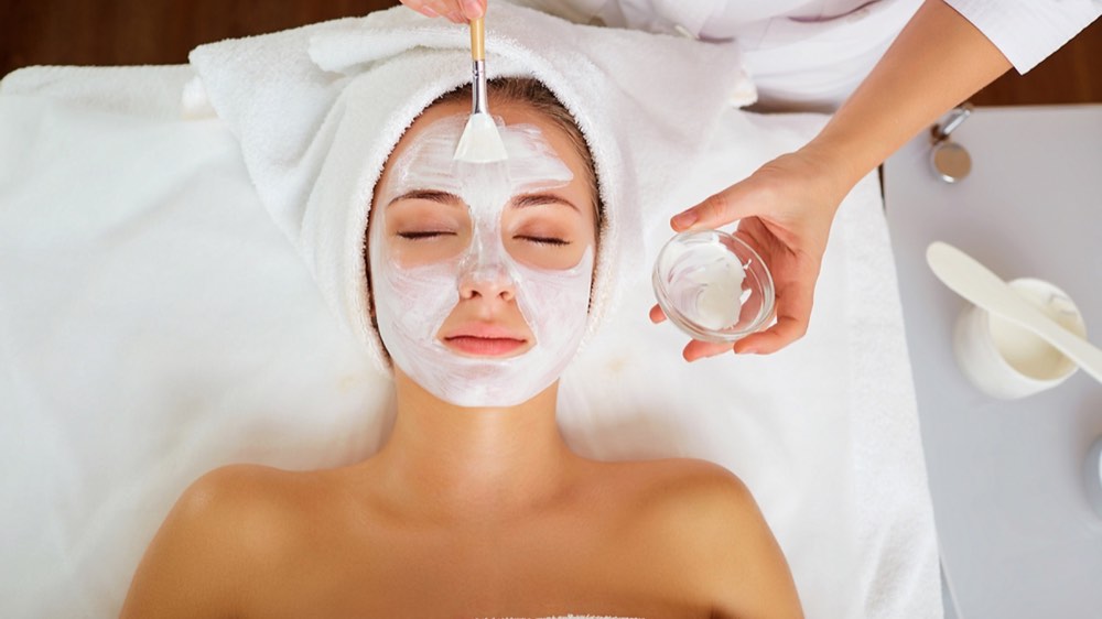 Applying Facial Mask at Spa