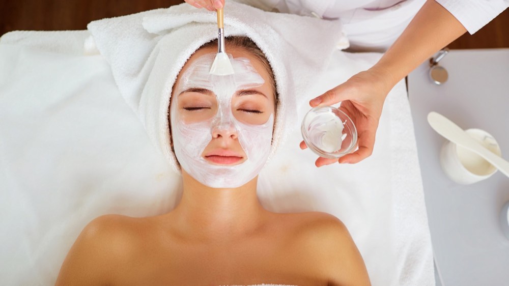 Applying Facial Mask at Spa
